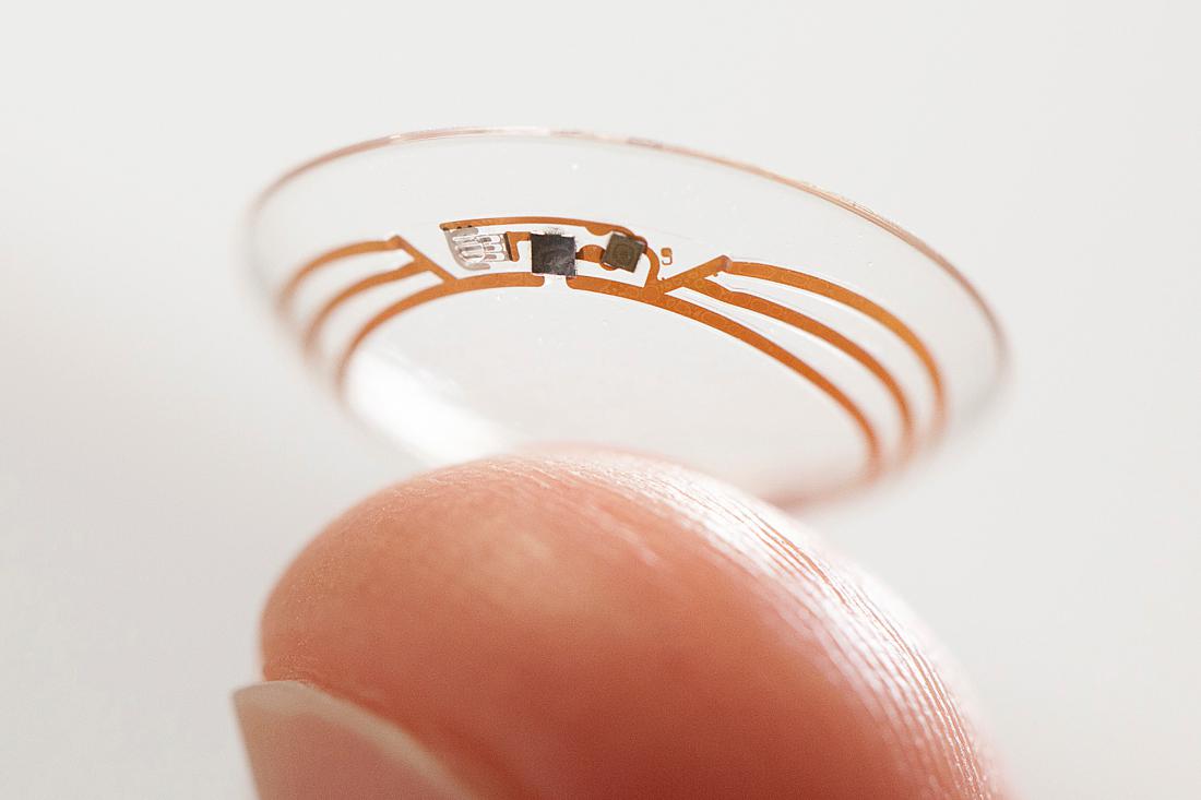 This undated photo released by Google shows a contact lens Google is testing to explore tear glucose. After years of scalding soldering hair-thin wires to miniaturize electronics, Brian Otis, Google X project lead, has burned his fingertips so often that he can no longer feel the tiny chips he made from scratch in Googles Silicon Valley headquarters, a small price to pay for what he says is the smallest wireless glucose sensor that has ever been made. (AP Photo/Google)